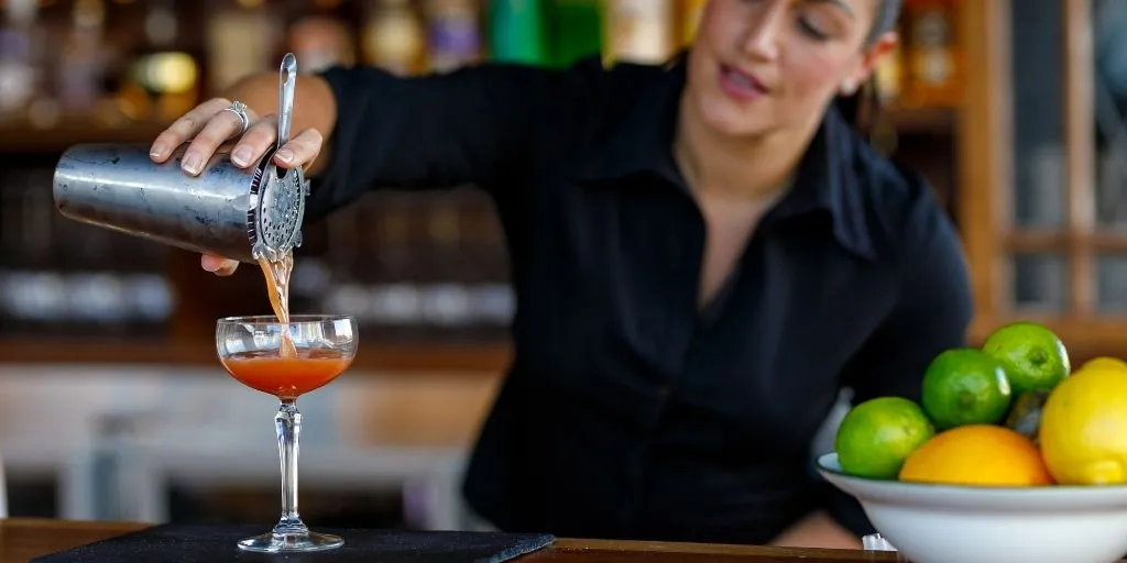 women pouring cocktail drink